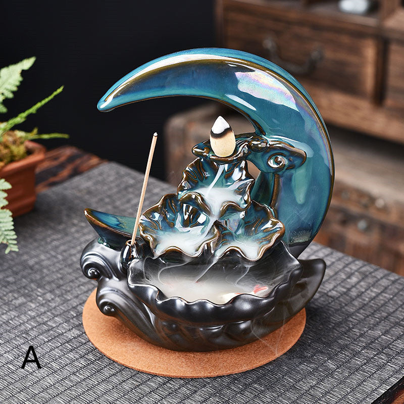 Sacred Moon Candle Co moon backflow incense burner iridescent blue ceramic crescent with cascading waterfall effect