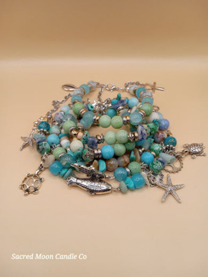 Bohemian beach crystal bracelet stack with turquoise beads and silver ocean-themed charms