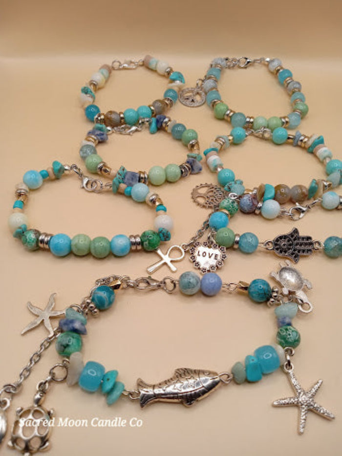 Bohemian beach crystal bracelet stack with turquoise beads and silver charms by Sacred Moon Candle Co