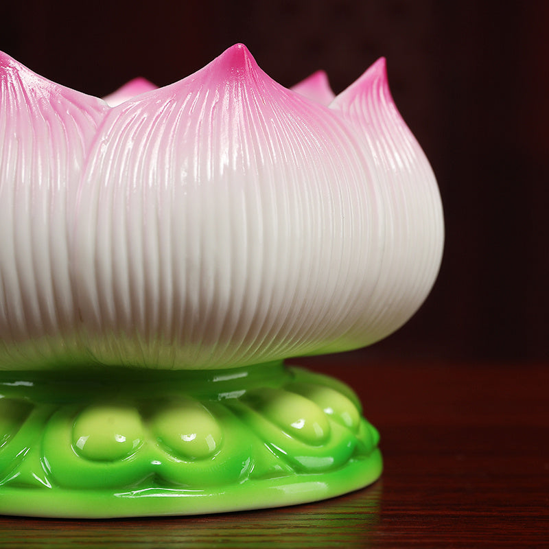 Sacred Moon Candle Co ceramic lotus incense burner with pink and white petals on a green base