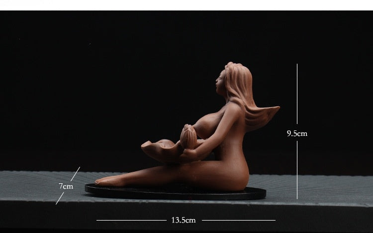 Ceramic sea goddess incense burner by Sacred Moon Candle Co with detailed sculpted figure sitting on a black base