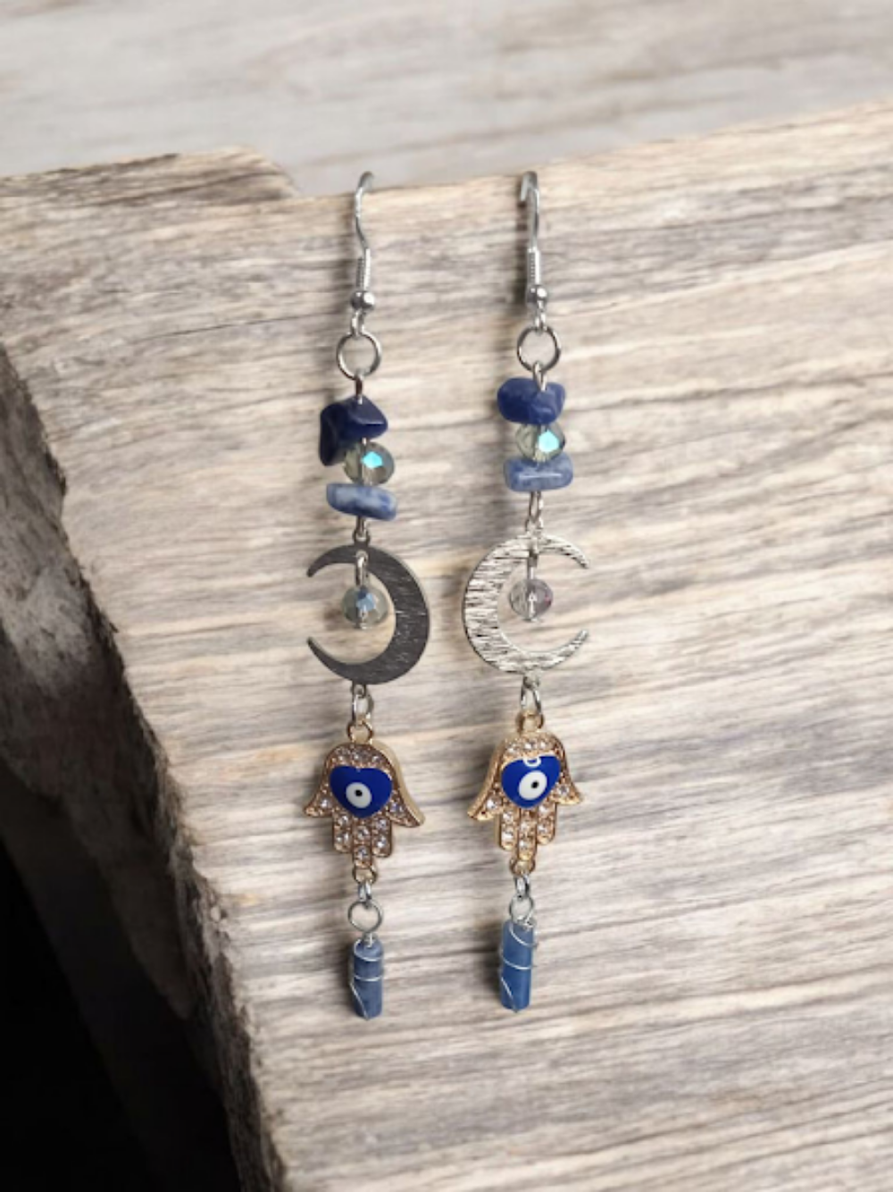 Sacred Moon Candle Co crescent moon hamsa earrings with blue stones and dangling charms