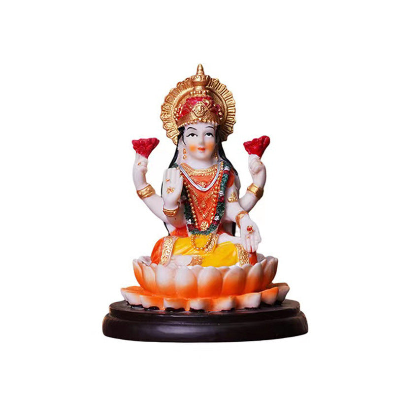 Sacred Moon Candle Co Lakshmi resin altar statue seated on a lotus with gold and red accents on black base