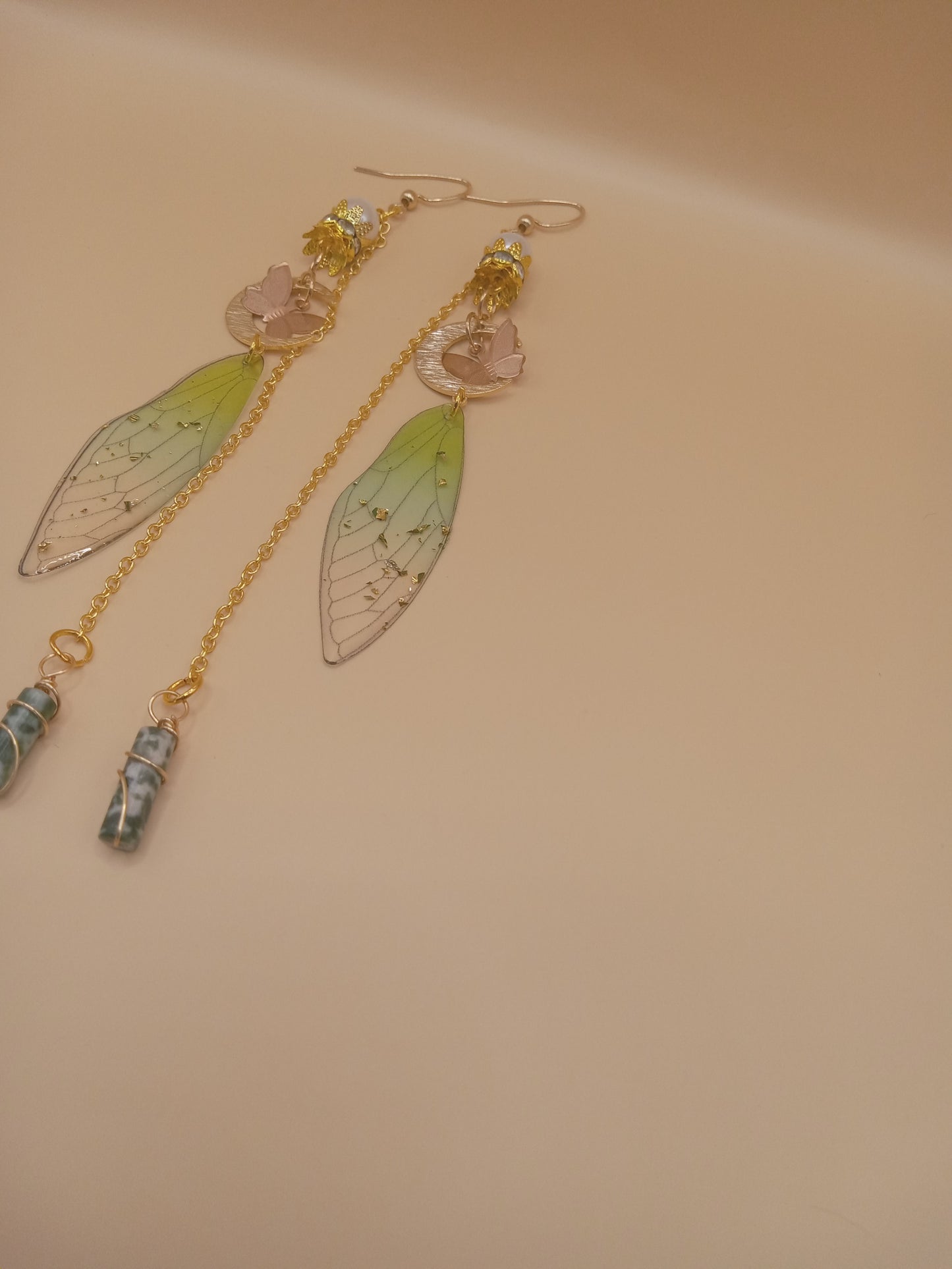 Sacred Moon Candle Co green fairy wing dangle earrings with gold chains pink flower accents and blue beads