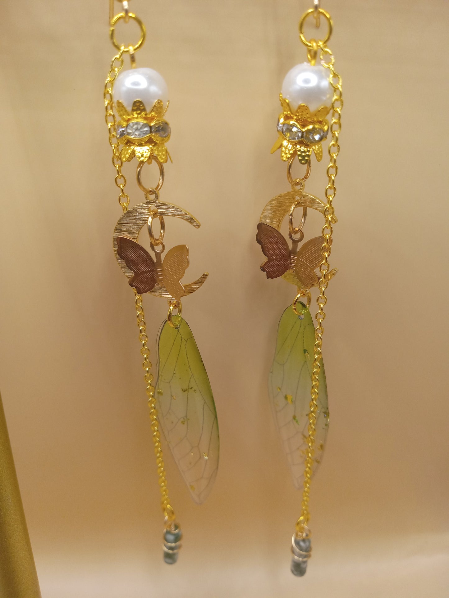 Sacred Moon Candle Co green fairy wing dangle earrings with translucent wings gold chains pearl tops moon and butterfly charms