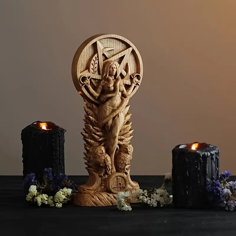 Carved wooden Lilith goddess altar statue with pentagram backdrop owls and black candles for ritual altars