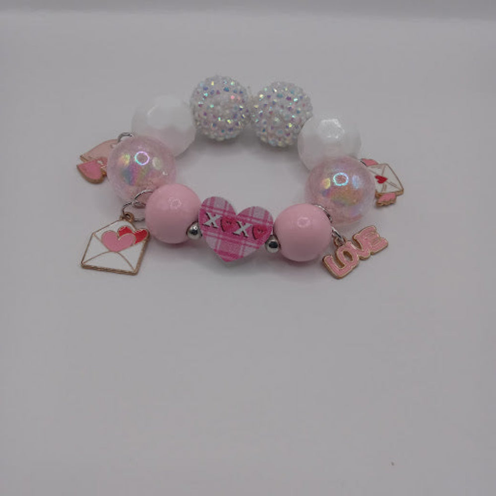 Sacred Moon Candle Co pink and white hugs and kisses heart jewelry bracelet with charm beads