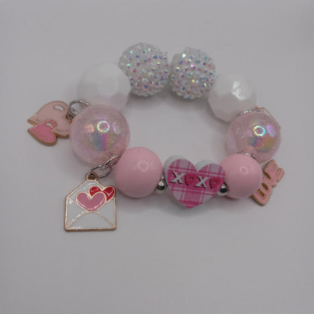 Sacred Moon Candle Co bracelet with hugs and kisses heart jewelry charm and pink and white beads