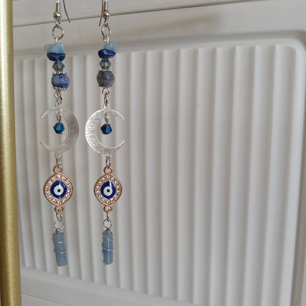 Sacred Moon Candle Co crescent moon evil eye earrings silver crescent charms blue beads crystal dangles