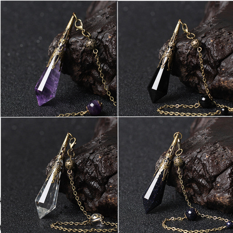 Sacred Moon Candle Co natural crystal pendant display showing amethyst black obsidian clear quartz and goldstone on brass chains