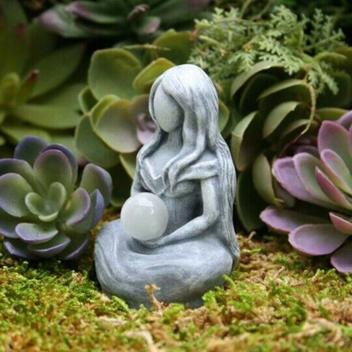 Sacred Moon Candle Co gray resin moon goddess alter figurine holding white crystal orb among succulents for altar