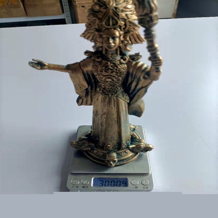 Sacred Moon Candle Co Hekate goddess statue bronze with ornate headdress and skull base on digital scale