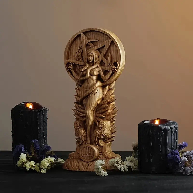 Wooden Lilith goddess altar statue by Sacred Moon Candle Co carved figure with black ritual candles and dried flowers