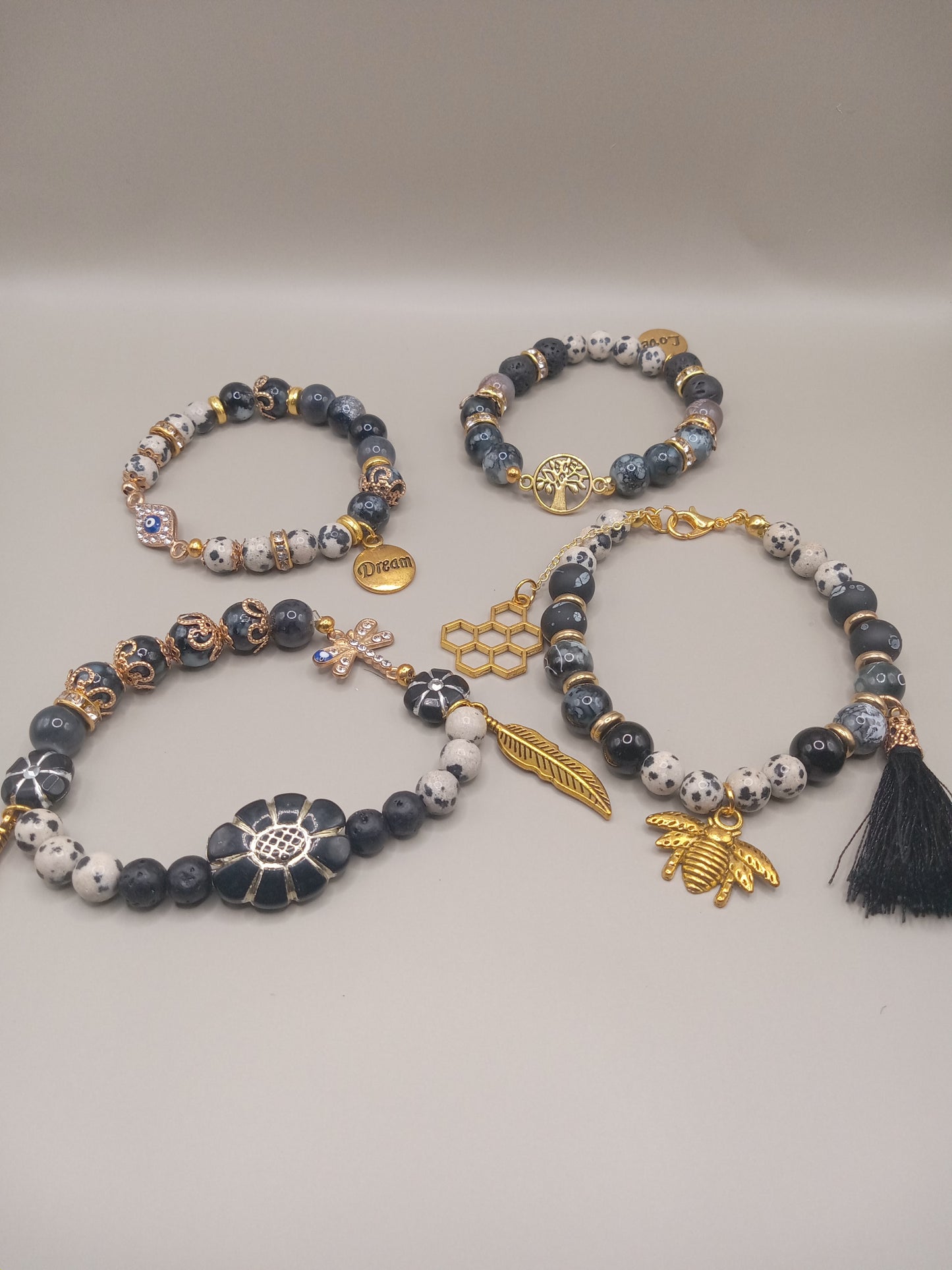 One with Nature Bohemian Dalmatian Jasper Bracelet Stack by Sacred Moon Candle Co with gold bee charm and tassel