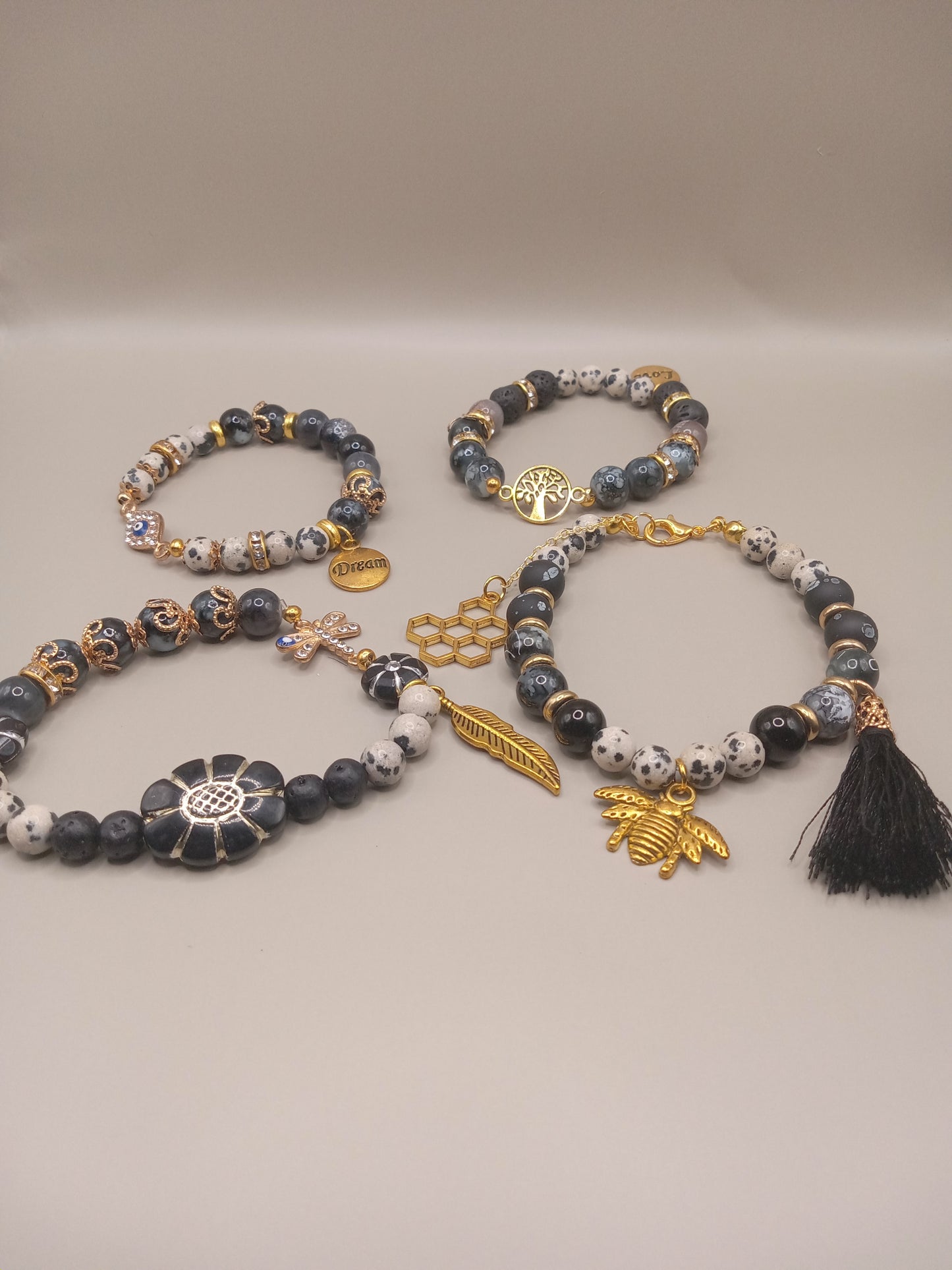 One with Nature Bohemian Dalmatian Jasper Bracelet Stack from Sacred Moon Candle Co with gold charms tassel and beaded layers