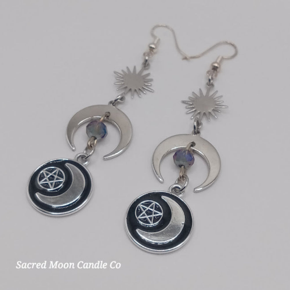 Sacred Moon Candle Co silver pentacle moon dangle earrings with sun charm and blue beads