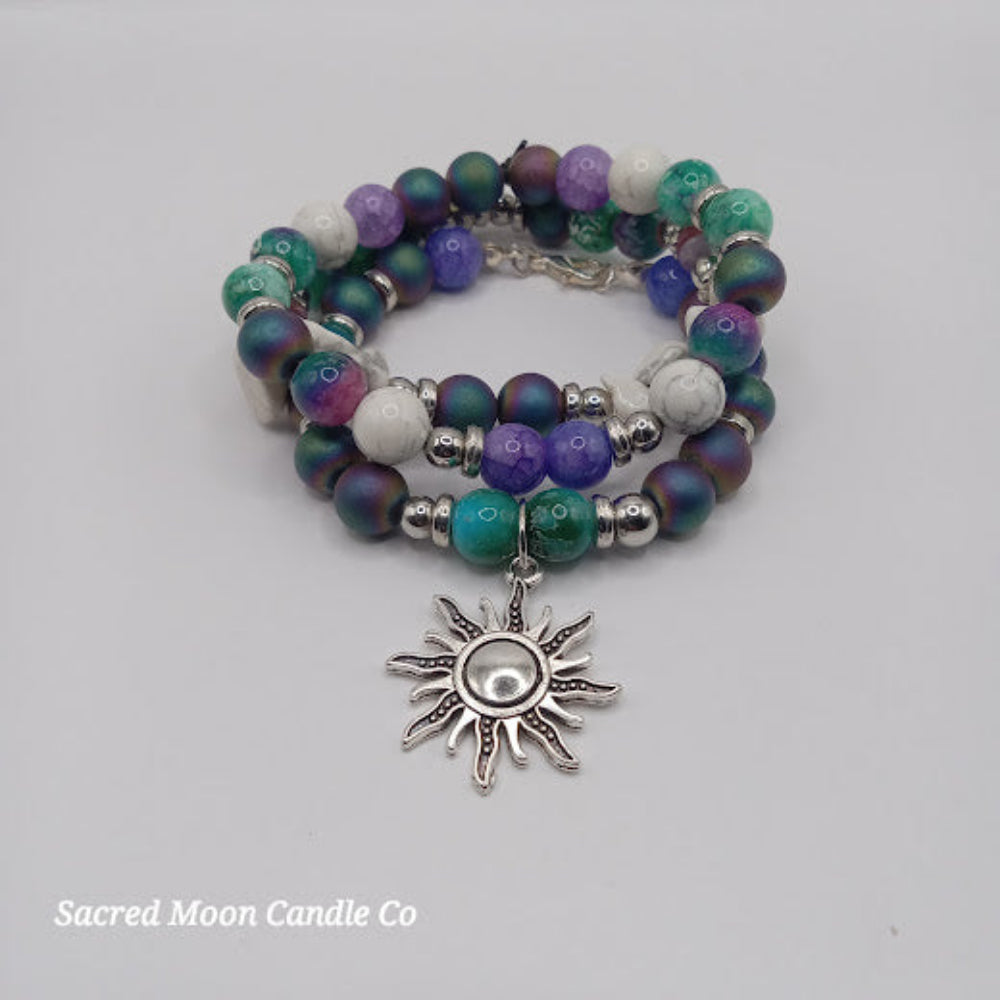 Celestial sun bracelet stack with multicolor beads and silver sun charm by Sacred Moon Candle Co