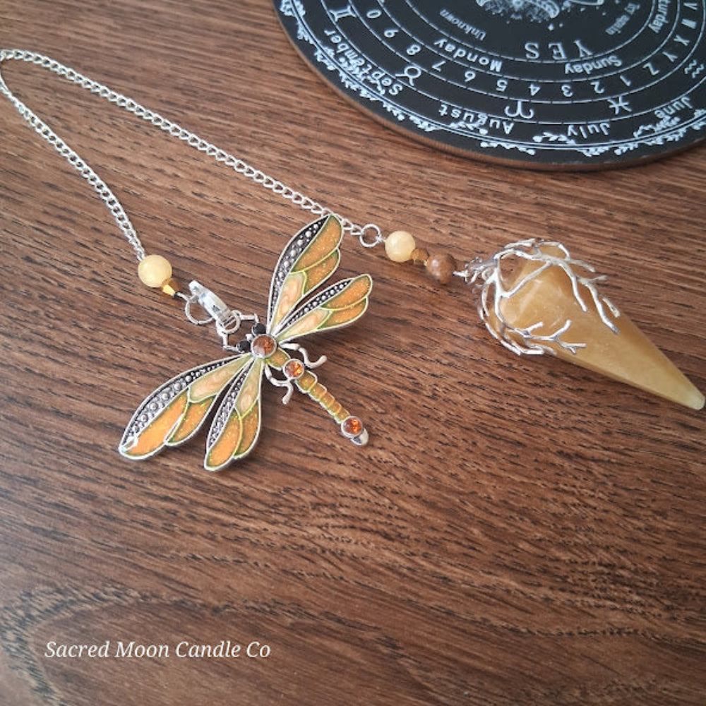 Golden healer quartz pendulum with dragonfly charm on chain for altar tools by Sacred Moon Candle Co
