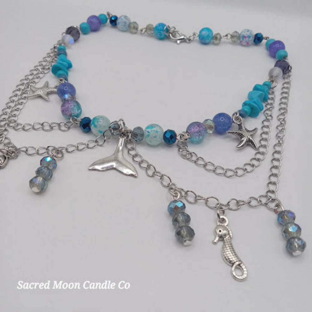 Sacred Moon Candle Co mermaid tail choker necklace with blue beads silver starfish seahorse charms