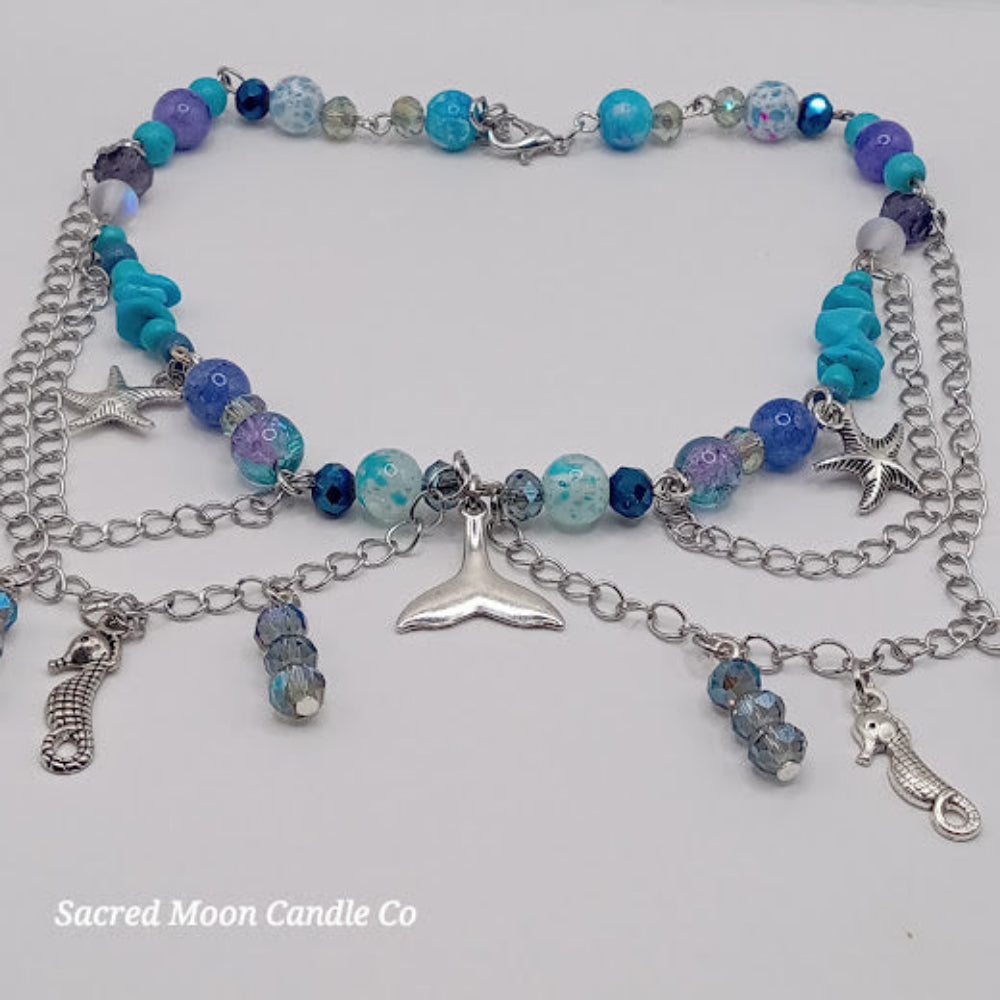 Sacred Moon Candle Co mermaid tail choker necklace with blue beads silver chains starfish and seahorse charms