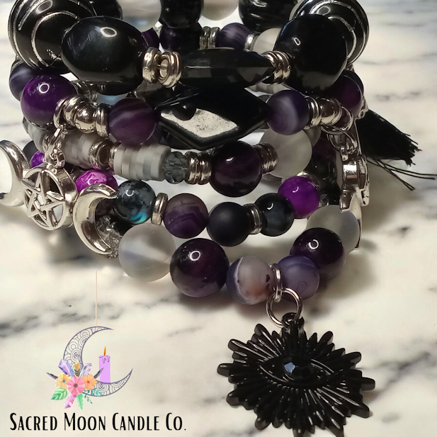 Sacred Moon Candle Co spiritual protection beaded bracelets stack with purple black white beads and silver charms