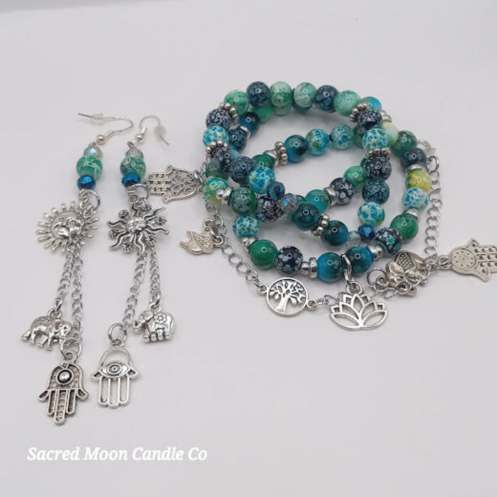 Teal boho earrings and bracelet stack with silver charms and green blue beads from Sacred Moon Candle Co