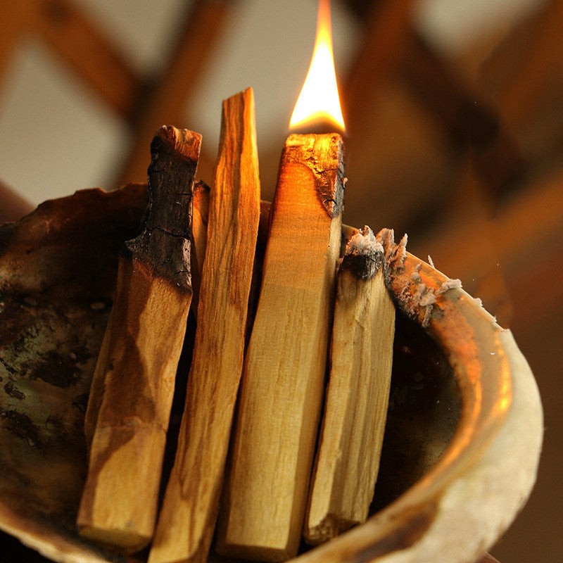 Sacred Moon Candle Co palo santo for meditation and rituals sticks burning in abalone shell bowl