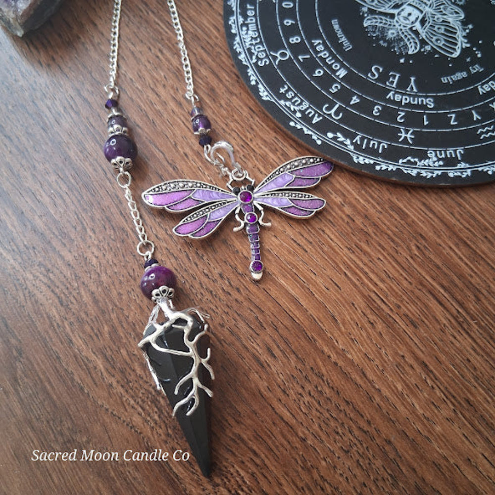 Black tourmaline Purple Tigers Eye Dragonfly Pendulum altar tool with silver chain on wooden surface