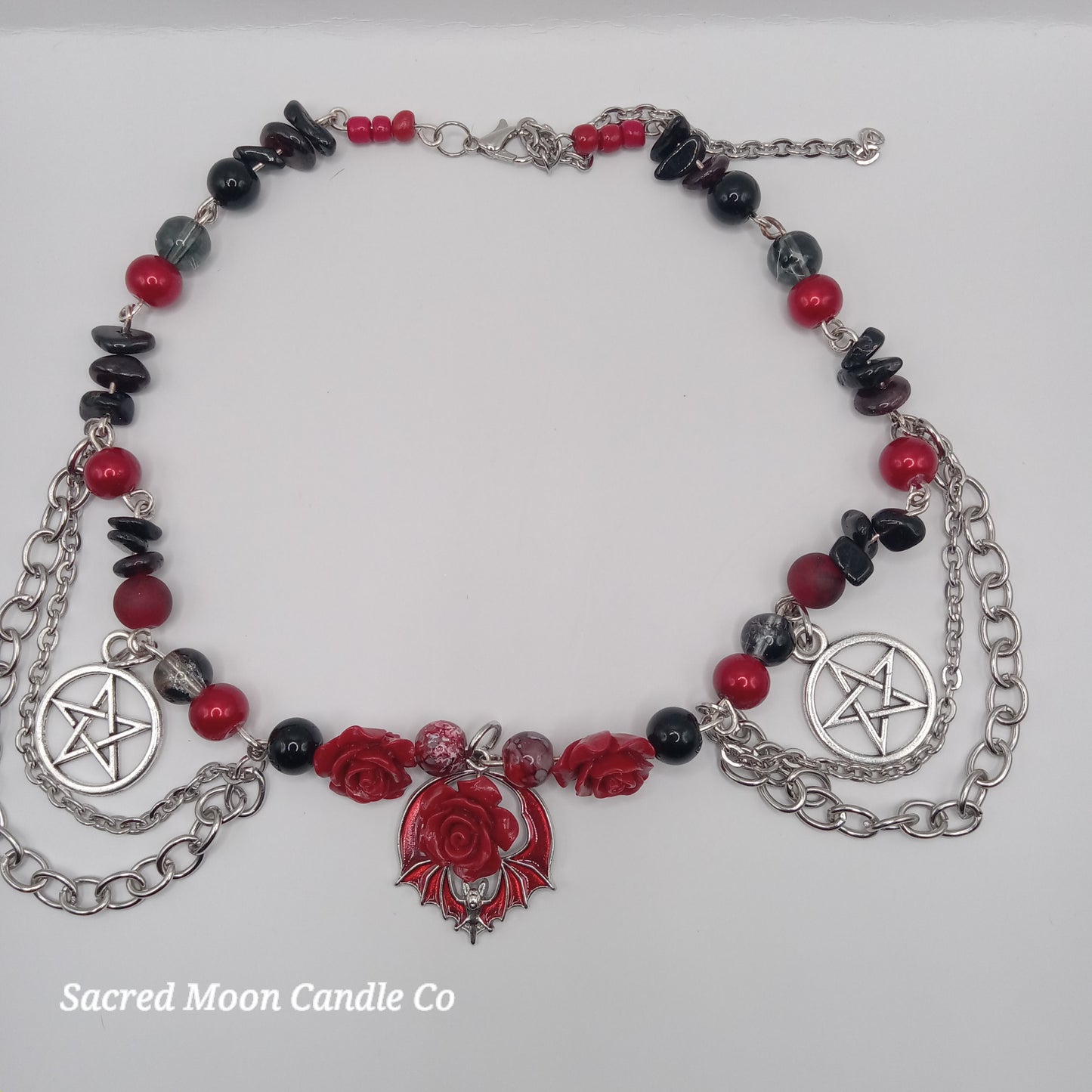 Handmade rose bat choker necklace with red roses, black beads, and silver pentagram charms