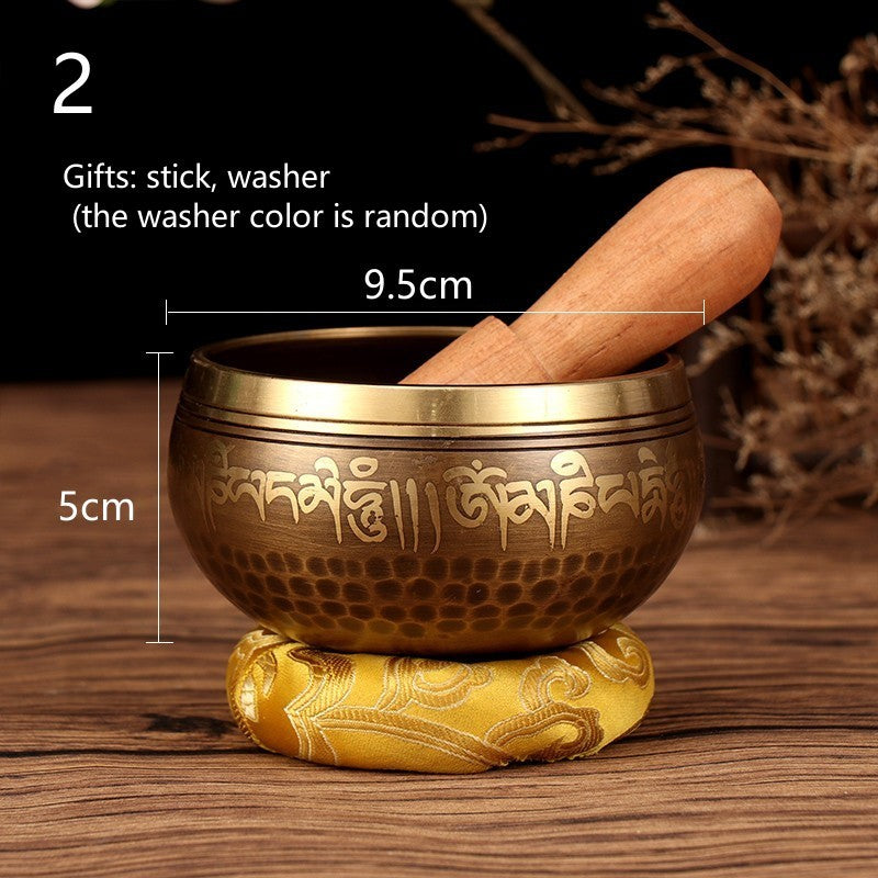 Sacred Moon Candle Co Tibetan Buddha mantra bowl with wooden stick and gold cushion on wooden surface