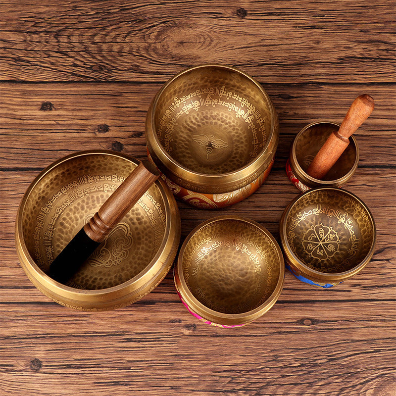 Set of Sacred Moon Candle Co Tibetan Buddha mantra bowl altar tools with wooden mallets on wood