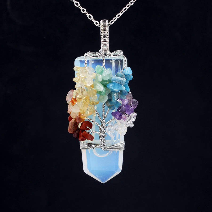 Sacred Moon Candle Co tree of life crystal necklace with colorful chakra stones wrapped in silver on blue quartz