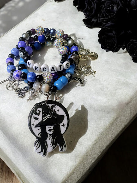 Hecate charm bracelet with blue and black beads and witch pendant by Sacred Moon Candle Co