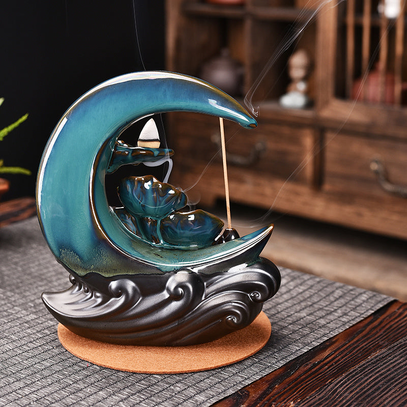 Sacred Moon Candle Co ceramic moon backflow incense burner teal crescent with wave base and cascading smoke