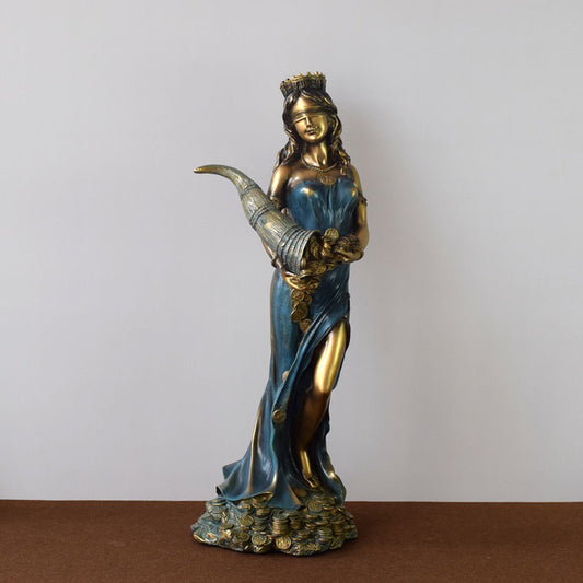 Tyche goddess statue by Sacred Moon Candle Co blue and gold resin figure holding a cornucopia standing on coins