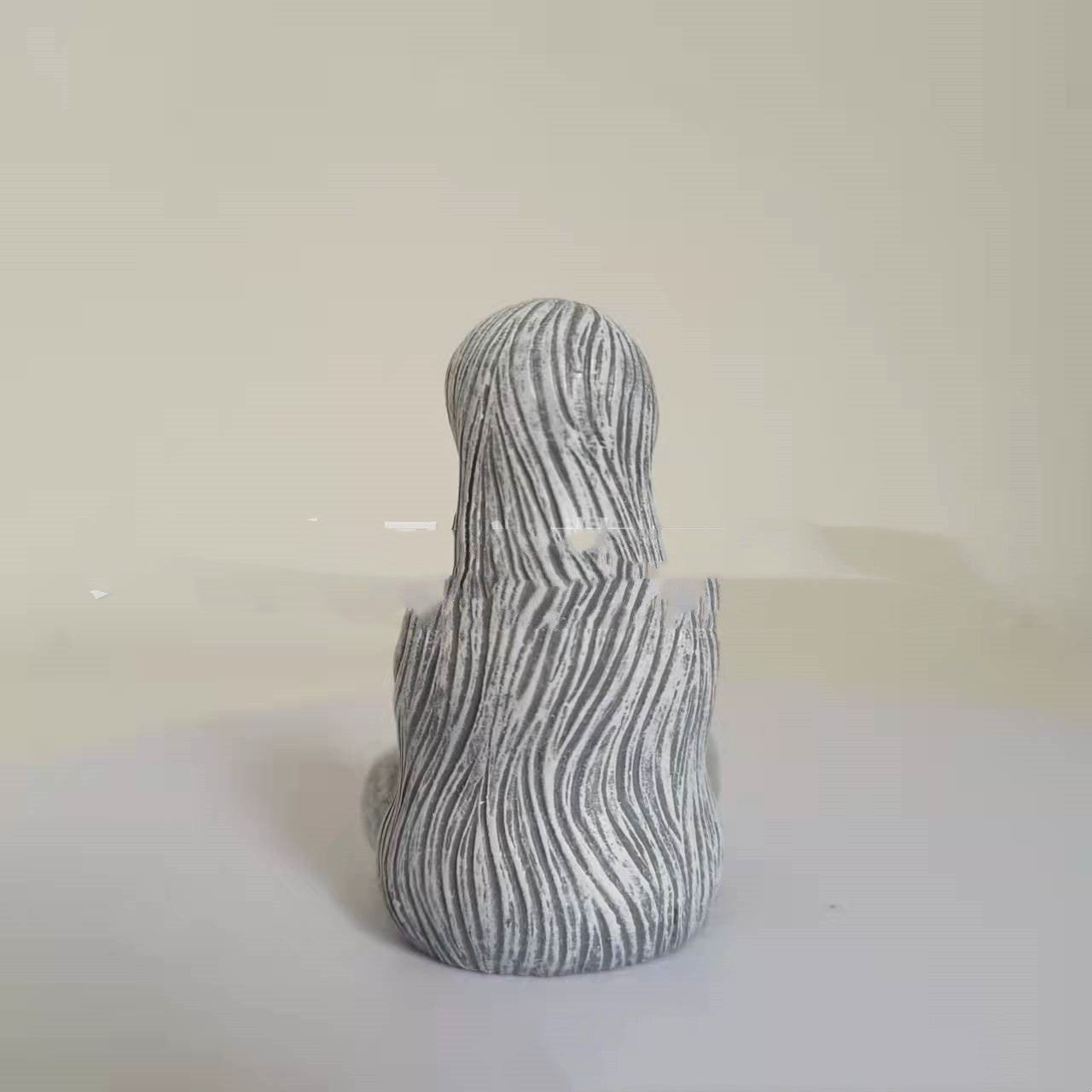 Sacred Moon Candle Co earth goddess Figurine seated stone statue with textured long hair back view