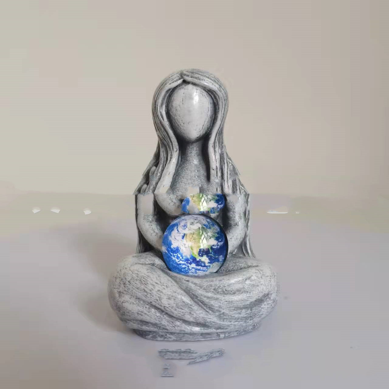 Sacred Moon Candle Co earth goddess Figurine gray seated woman holding a painted globe decorative altar tool