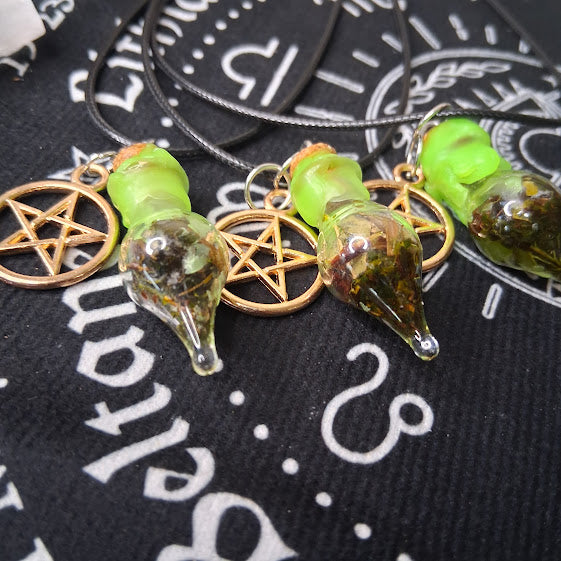 Prosperity spell bottle necklace with green glass vial and pentacle charm on black cord by Sacred Moon Candle Co