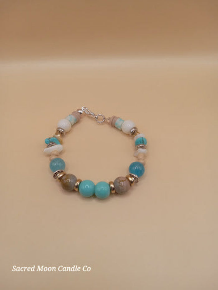 Bohemian beach crystal bracelet stack with turquoise and neutral beads from Sacred Moon Candle Co