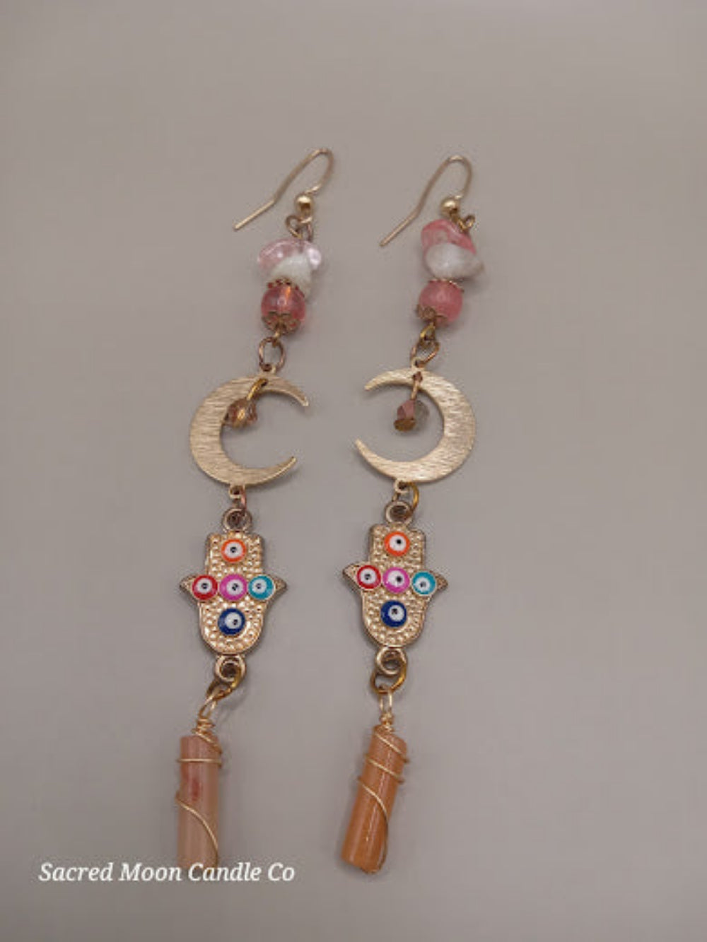 Crescent moon hamsa earrings wire wrapped peach aventurine with colorful beads and gold hooks from Sacred Moon Candle Co