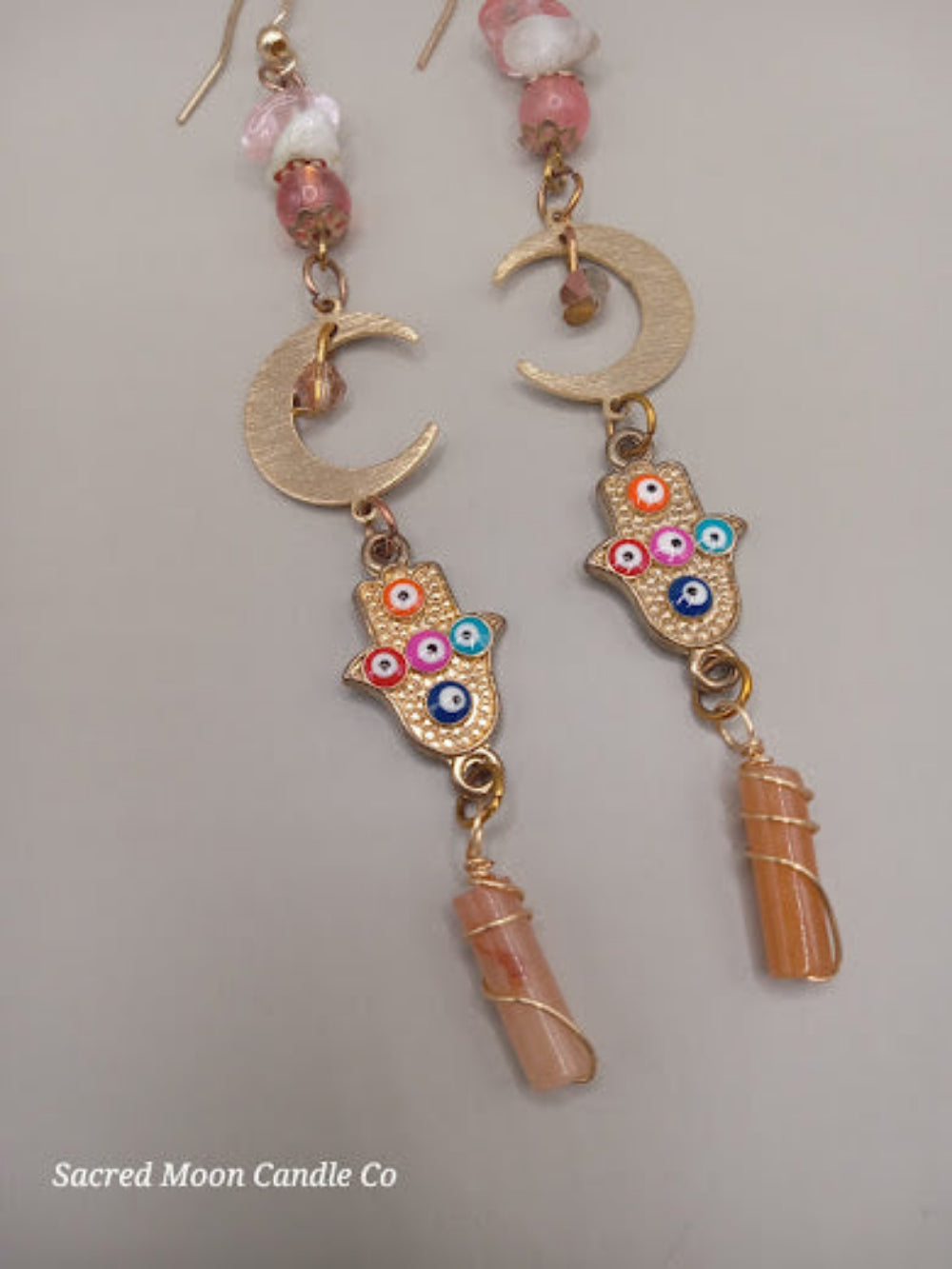 Crescent moon hamsa earrings wire wrapped peach aventurine by Sacred Moon Candle Co with colorful accents