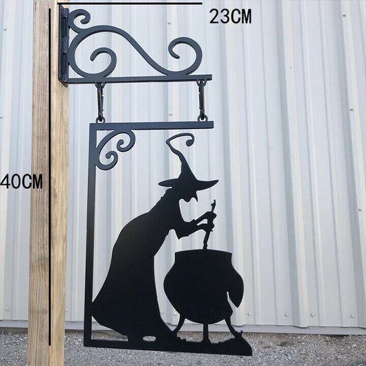 Sacred Moon Candle Co witch cauldron metal wall art featuring a witch stirring a cauldron in black metal silhouette
