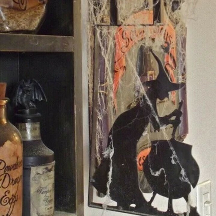 Sacred Moon Candle Co witch cauldron metal wall art with witch silhouette stirring cauldron in black metal