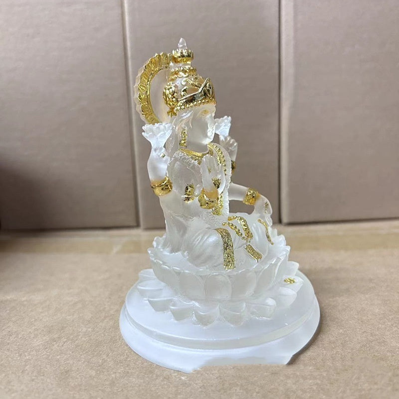 Sacred Moon Candle Co Lakshmi resin altar statue translucent white with gold accents seated on lotus base for home altar