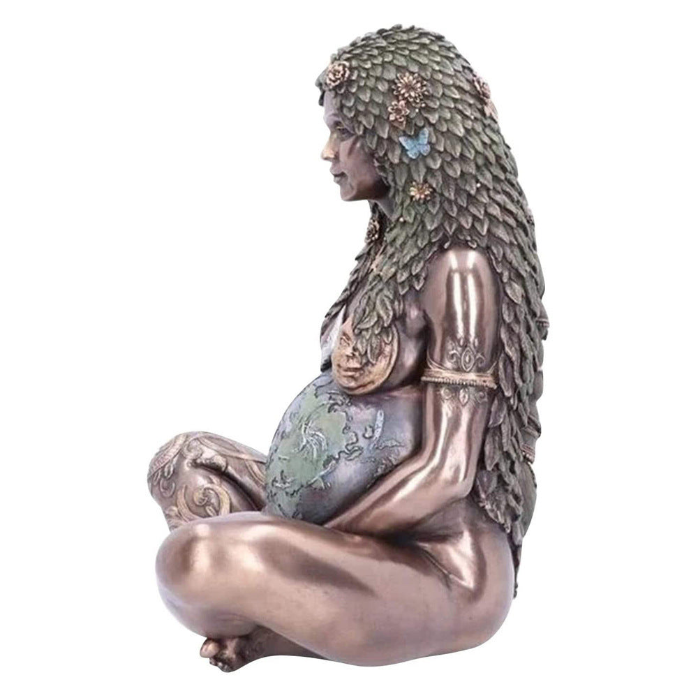 Mother Earth goddess statue by Sacred Moon Candle Co seated pregnant figure with leaf hair and globe belly