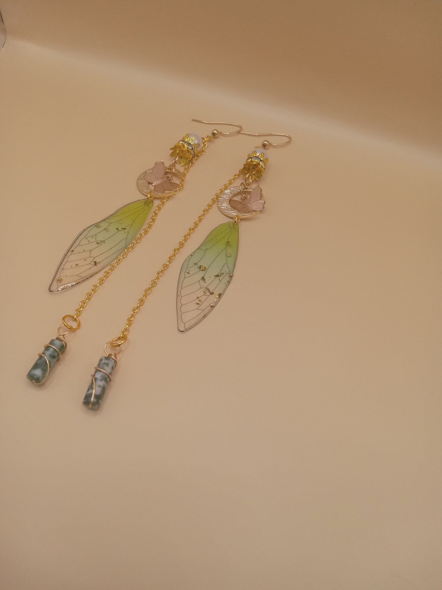 Sacred Moon Candle Co green fairy wing dangle earrings with gold chains rose moon accents and green wing charms