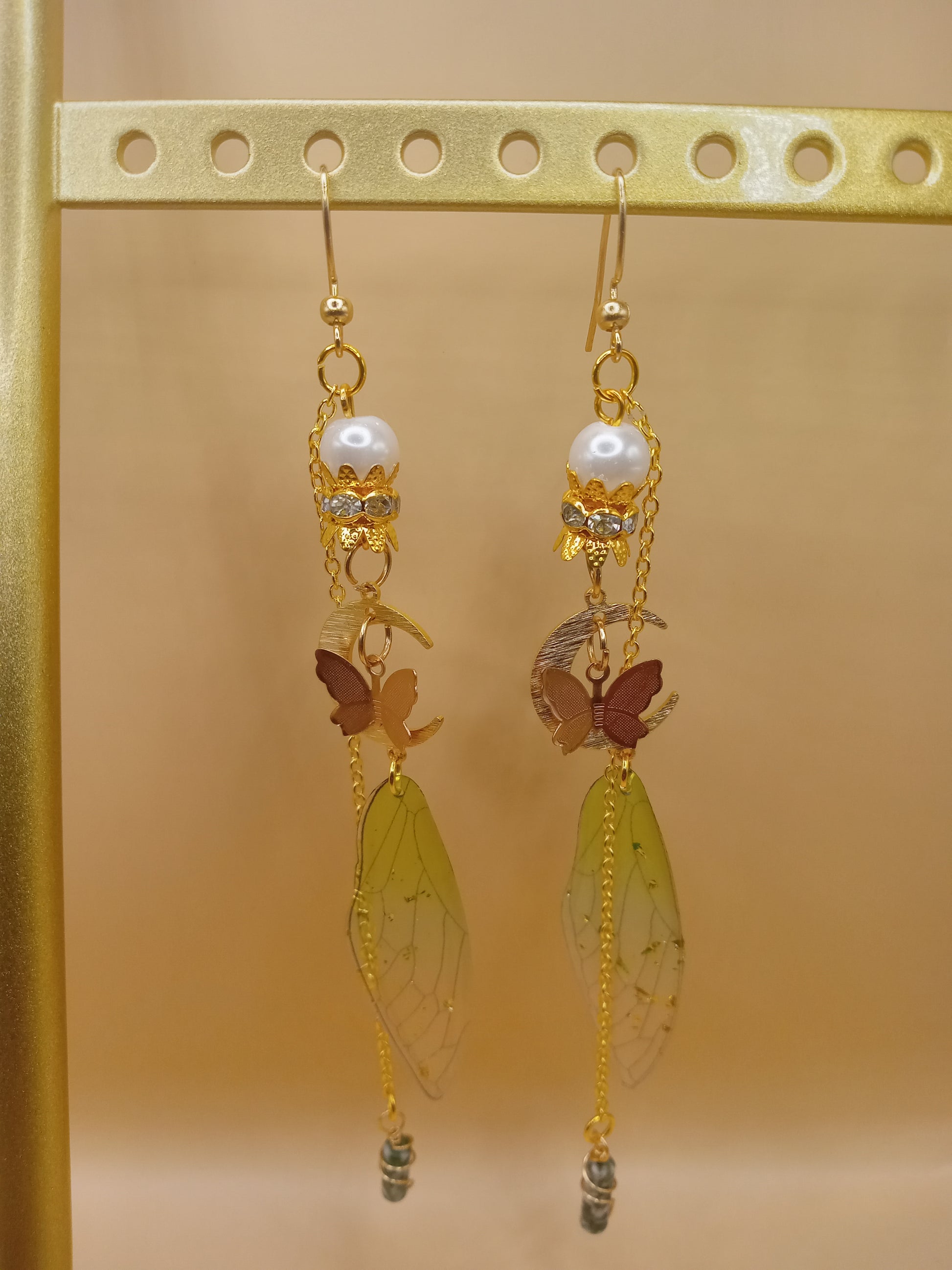 Sacred Moon Candle Co green fairy wing dangle earrings with gold chains pearls and translucent green wings