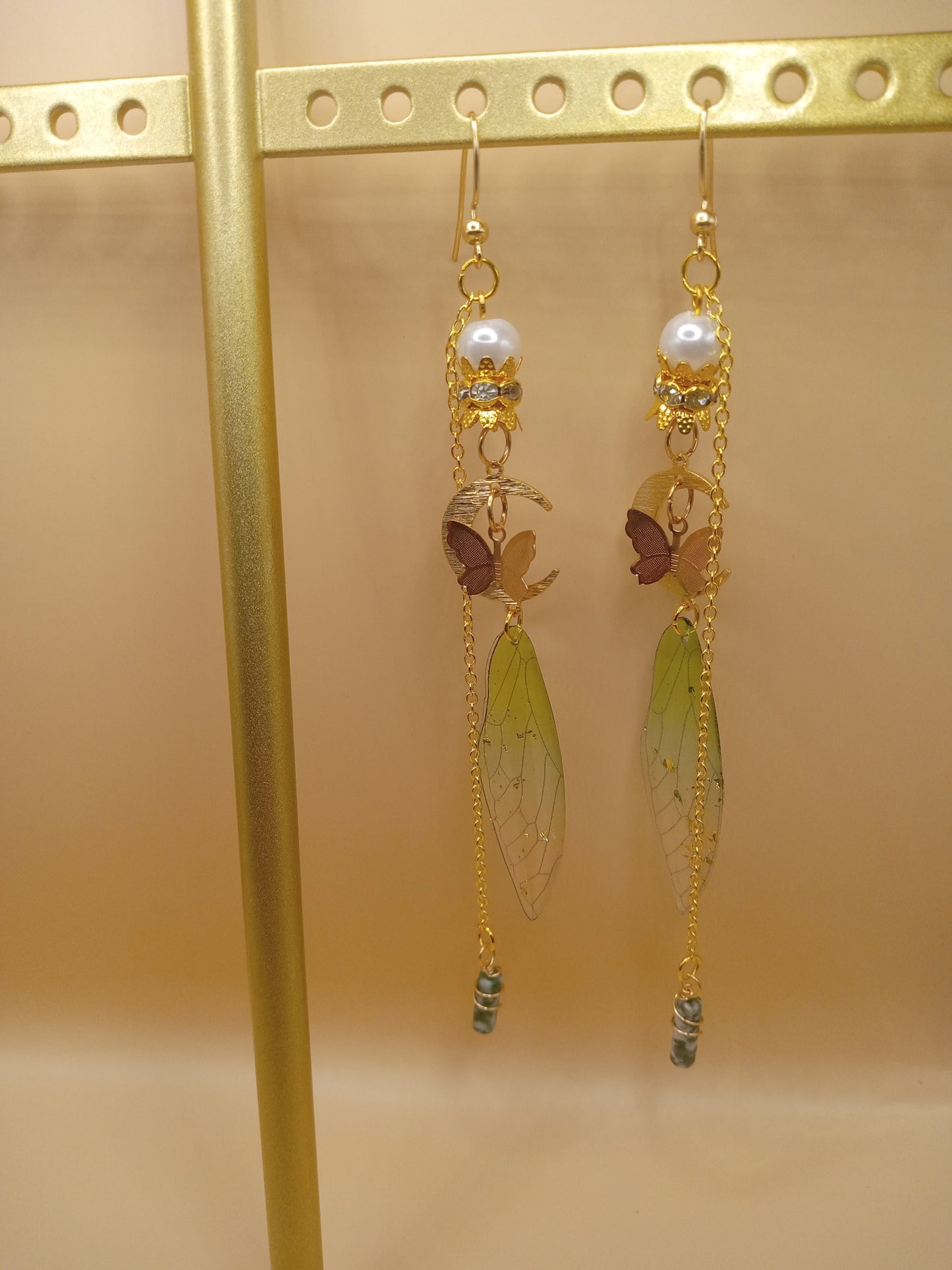 Sacred Moon Candle Co green fairy wing dangle earrings with pearl and translucent green wing pendants and gold chains