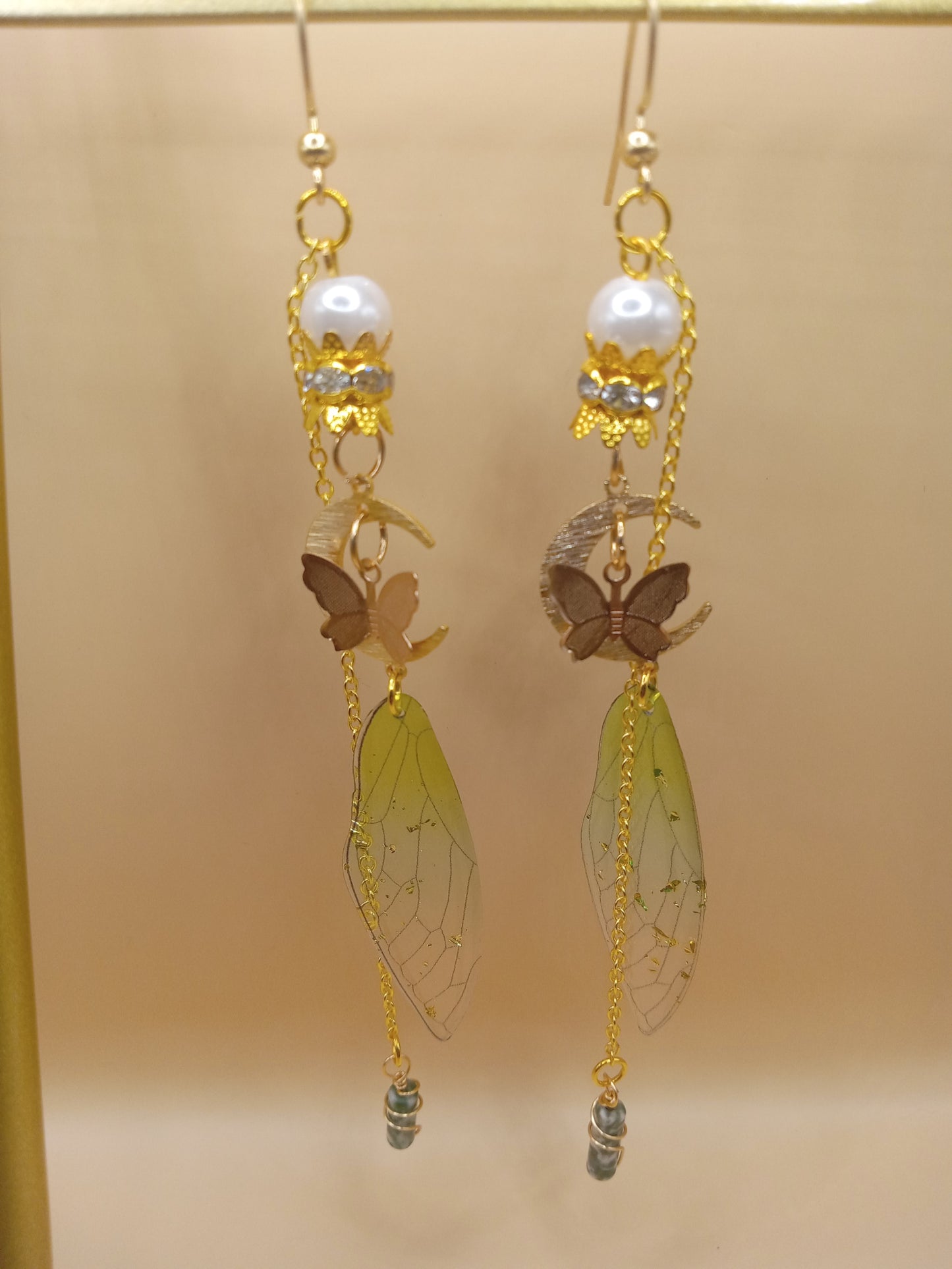 Sacred Moon Candle Co green fairy wing dangle earrings with gold chains pearl beads and butterfly charms