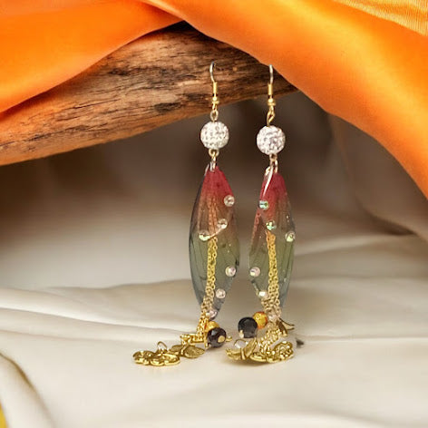 Sacred Moon Candle Co firefly fairy earrings with colorful wings and gold chain details